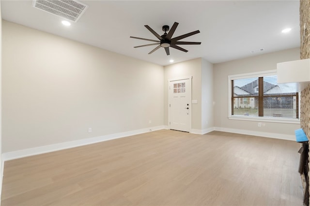 unfurnished living room featuring light wood-type flooring, recessed lighting, baseboards, and visible vents