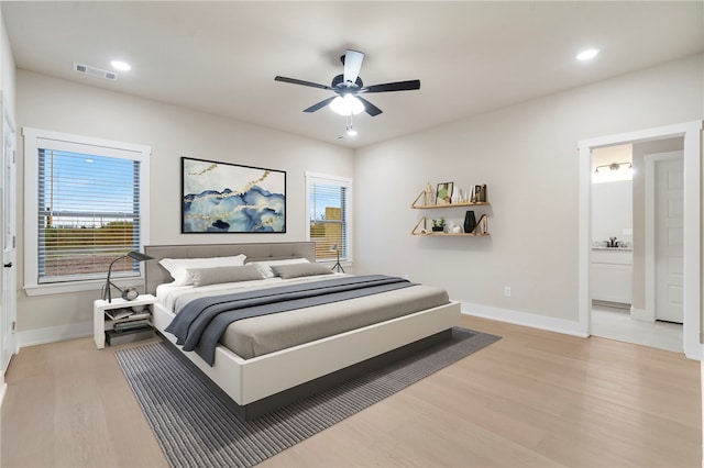 bedroom featuring baseboards, visible vents, light wood-style flooring, and recessed lighting