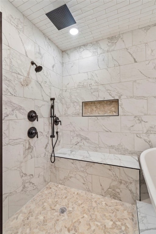 bathroom featuring tiled shower