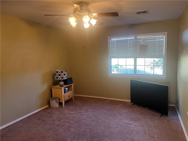 unfurnished room featuring carpet floors and ceiling fan