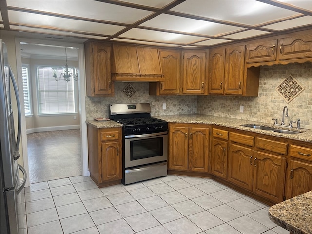 kitchen with decorative backsplash, sink, stainless steel appliances, and custom exhaust hood