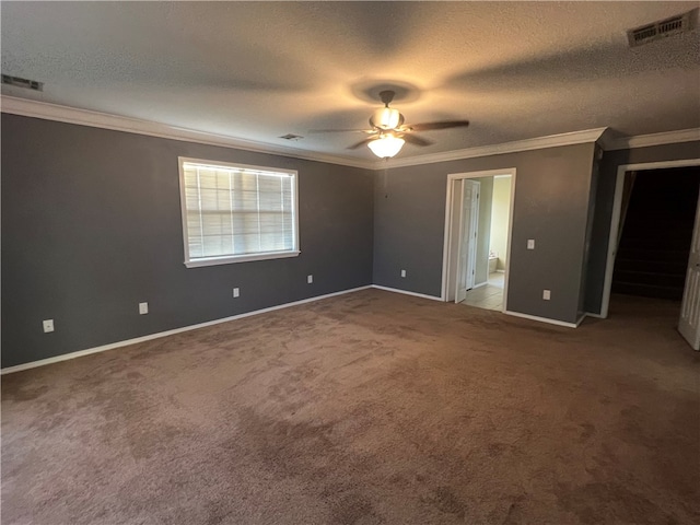 unfurnished bedroom with carpet flooring, ceiling fan, ensuite bathroom, and a textured ceiling