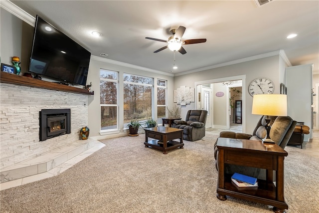 living room featuring ceiling fan, carpet, and ornamental molding