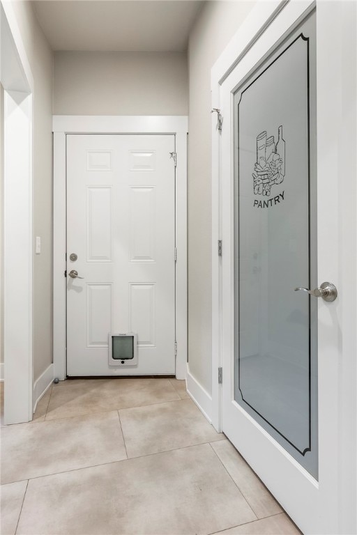 interior space with light tile patterned floors