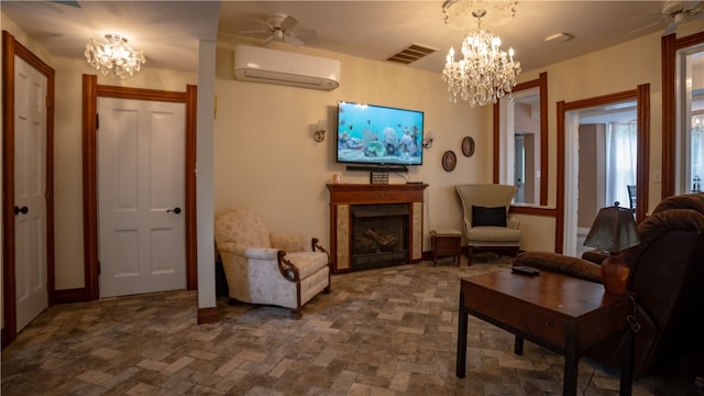 living area featuring a wall unit AC and ceiling fan with notable chandelier