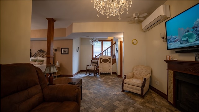 living room featuring a wall unit AC and ceiling fan with notable chandelier