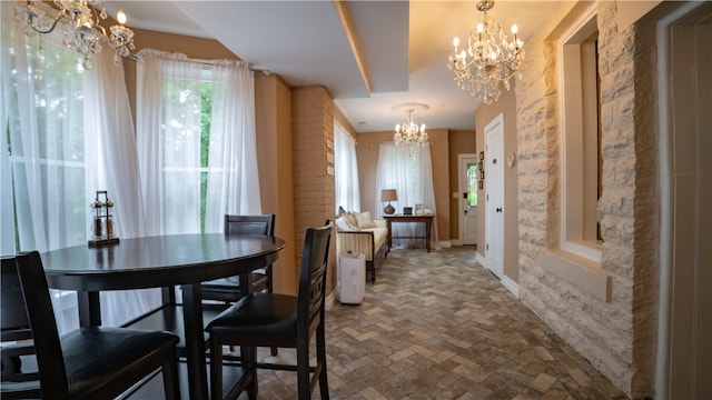 dining space featuring a notable chandelier