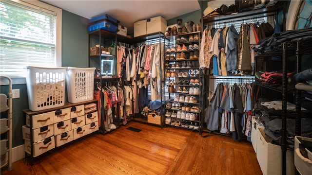 spacious closet with hardwood / wood-style flooring