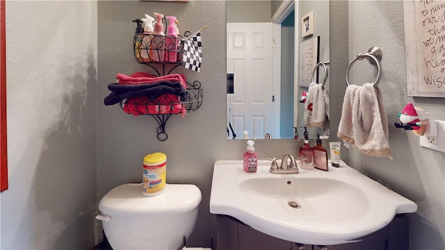 bathroom featuring toilet and sink