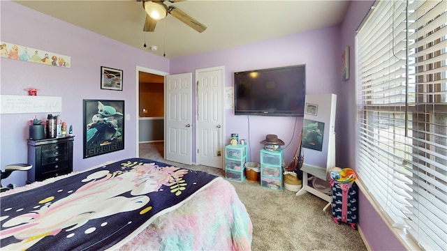 bedroom featuring light carpet and ceiling fan