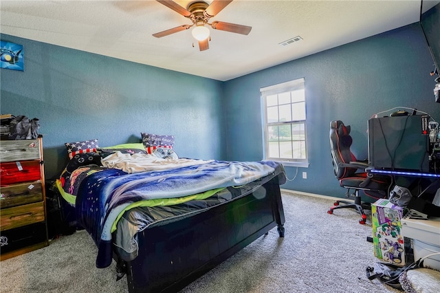 carpeted bedroom featuring ceiling fan