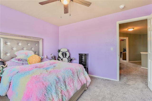 carpeted bedroom with ceiling fan