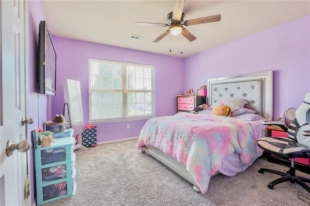 bedroom featuring ceiling fan and carpet