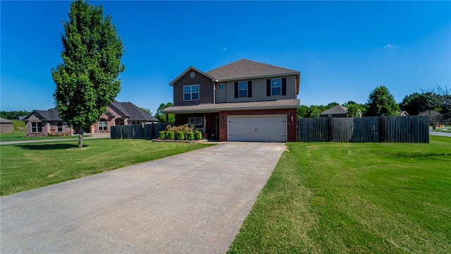 view of property with a garage and a front yard