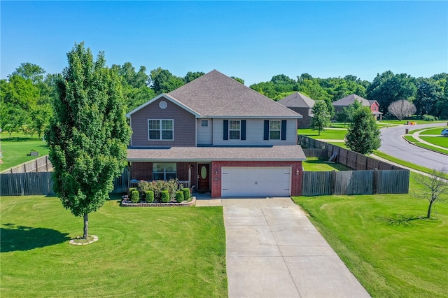 view of front of property featuring a garage and a front lawn