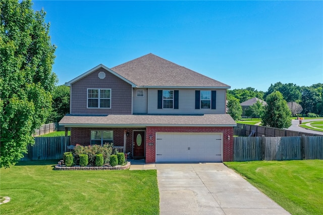 view of front of house featuring a front lawn and a garage