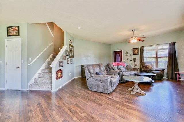 living room with wood-type flooring and ceiling fan