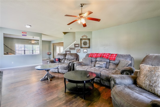 living room featuring dark hardwood / wood-style floors and ceiling fan