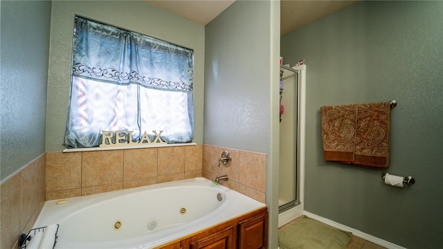 bathroom with shower with separate bathtub