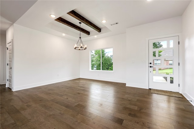 interior space featuring beamed ceiling, an inviting chandelier, plenty of natural light, and dark wood-type flooring