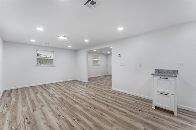 unfurnished room with light hardwood / wood-style flooring