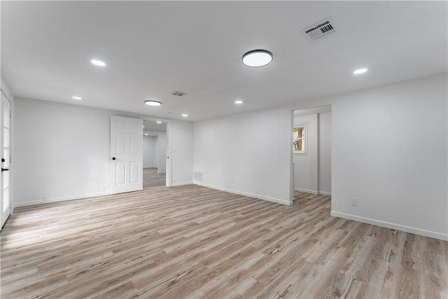 spare room with light wood-type flooring