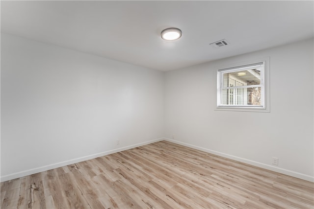 empty room with light wood-type flooring