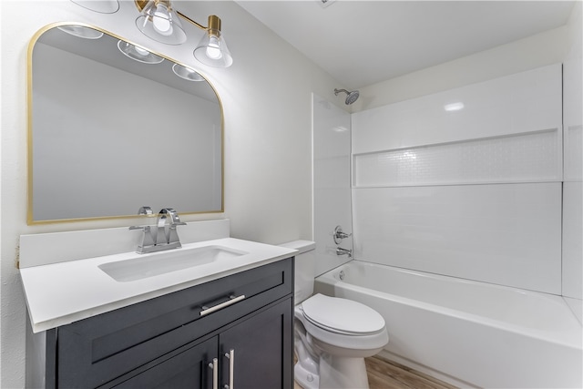 full bathroom featuring vanity, wood-type flooring,  shower combination, and toilet