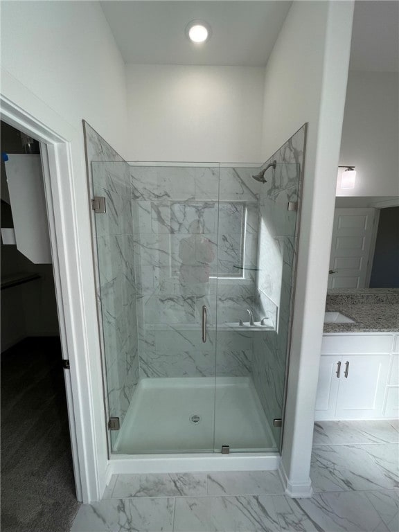 bathroom featuring vanity and walk in shower