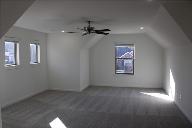 additional living space with ceiling fan, carpet floors, and lofted ceiling