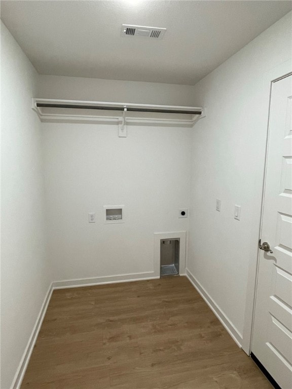 laundry room with washer hookup, electric dryer hookup, and wood-type flooring