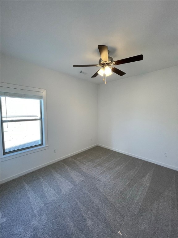 carpeted empty room with ceiling fan