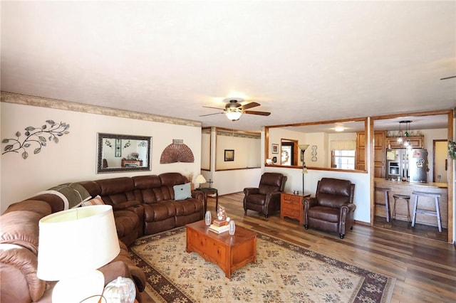 living room with ceiling fan and wood-type flooring