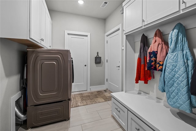 mudroom with washer / dryer and light tile patterned floors