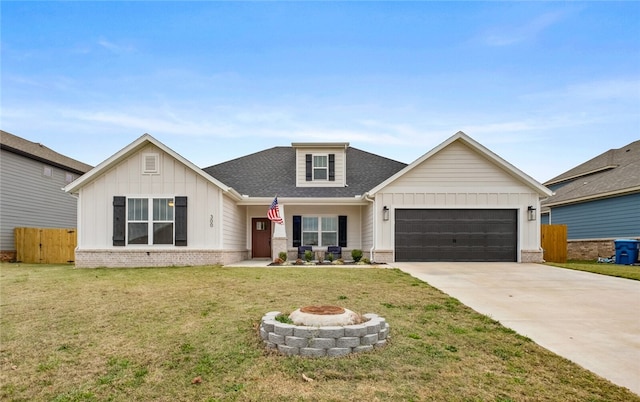 view of front of home with a garage and a front lawn