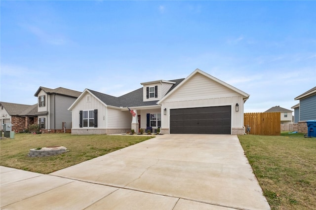 view of front facade with a garage and a front lawn