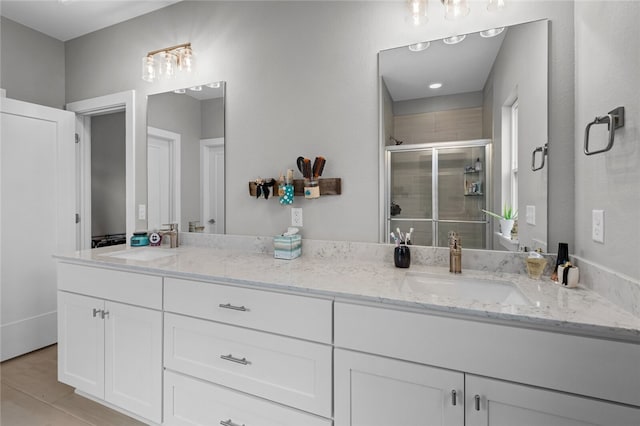 bathroom with vanity and an enclosed shower