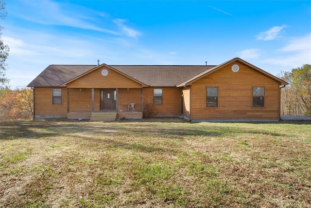 ranch-style home featuring a front yard