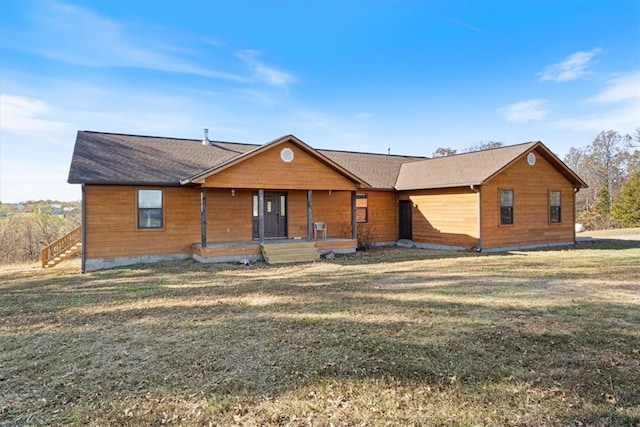 view of front of home featuring a front lawn and a porch