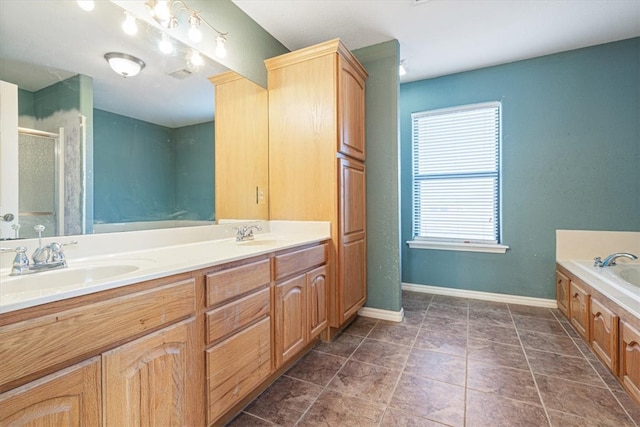 bathroom with tile patterned floors, separate shower and tub, and vanity