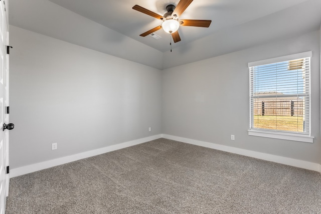 empty room featuring carpet and ceiling fan