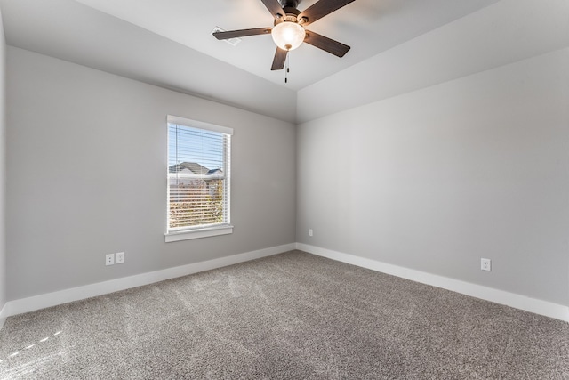 carpeted spare room with ceiling fan