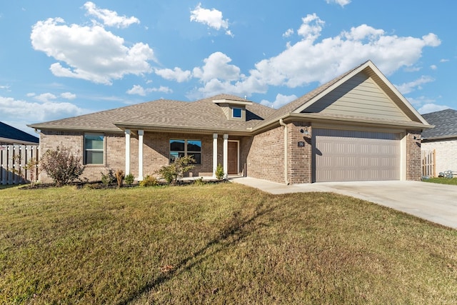 ranch-style home featuring a garage and a front lawn