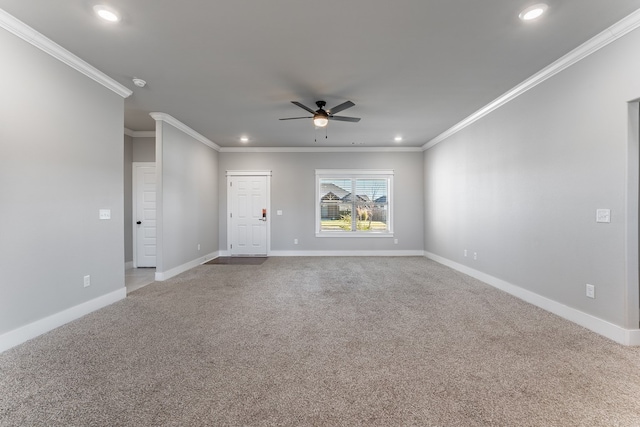 unfurnished room featuring light carpet, ceiling fan, and crown molding