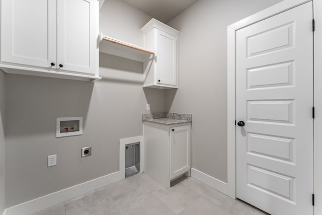 clothes washing area featuring electric dryer hookup, cabinets, and hookup for a washing machine