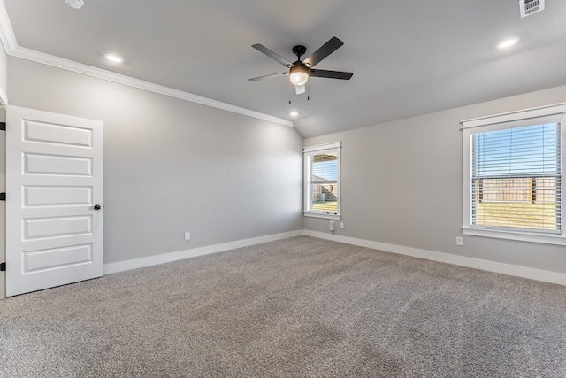 spare room with carpet, crown molding, ceiling fan, and a healthy amount of sunlight