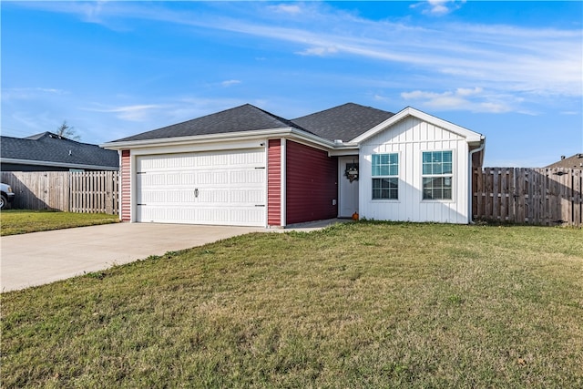 single story home featuring a garage and a front lawn