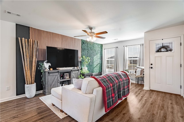 living room with hardwood / wood-style floors and ceiling fan