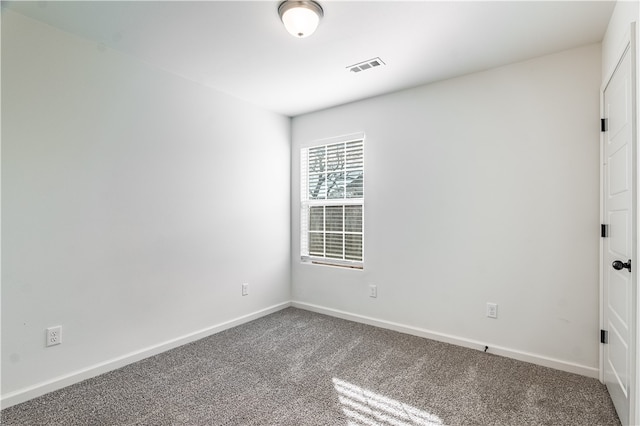 spare room featuring carpet floors