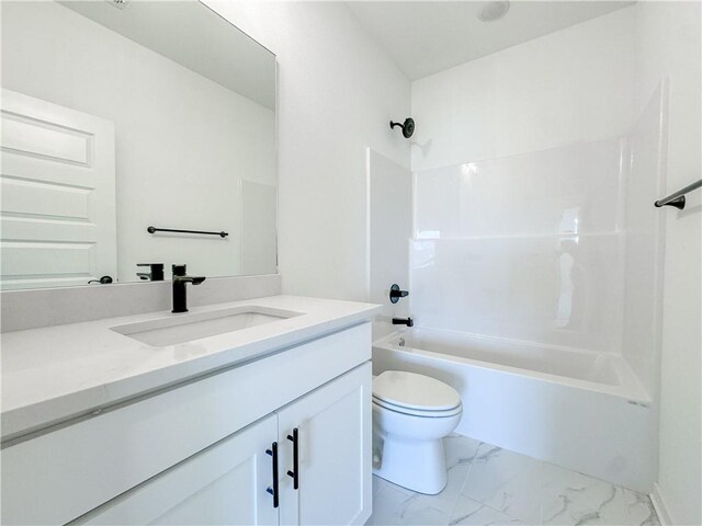 bathroom with toilet, marble finish floor, vanity, and shower / bathing tub combination